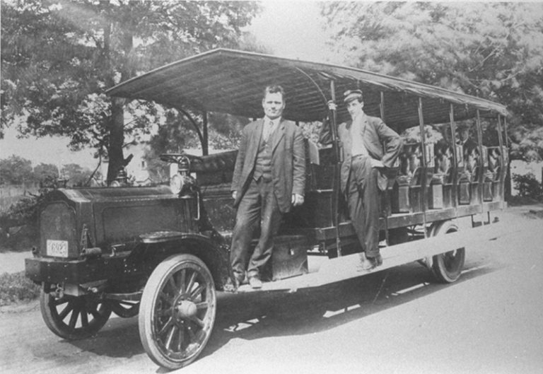 John R. Caswell and Bowen Von Schade on the bus that Caswell built to carry passengers between the east and west ferries.