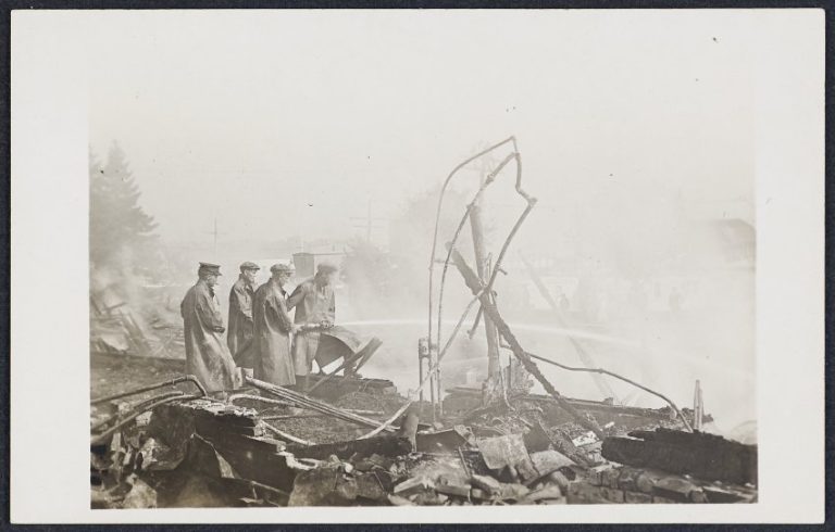 Men looking at the rubble