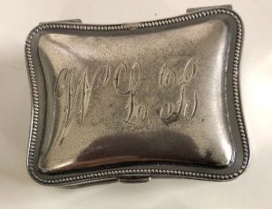Silver stamp box engraved with the initials of its owner, Dr. William Lincoln Bates.
