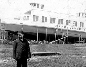 Stillman Saunders on the beach at his boatbuilding facility in Saunderstown